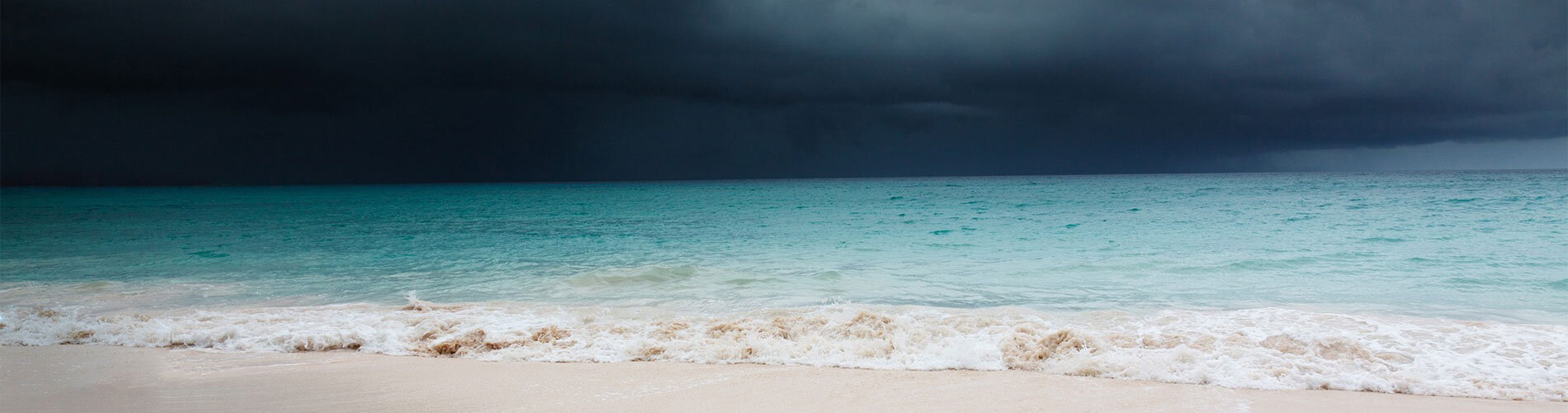 Dark clouds over a beach.